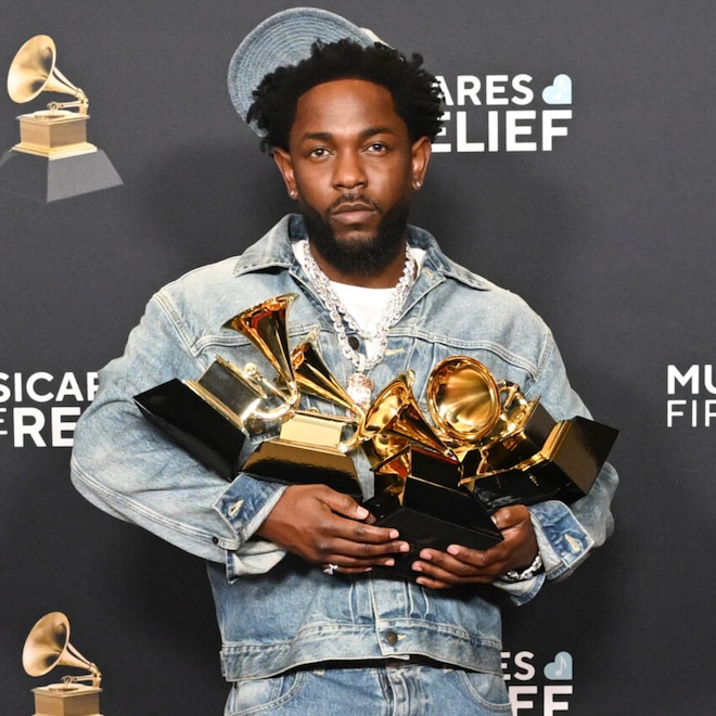 Kendrick Lamar poses with awards at Grammys 2025.
